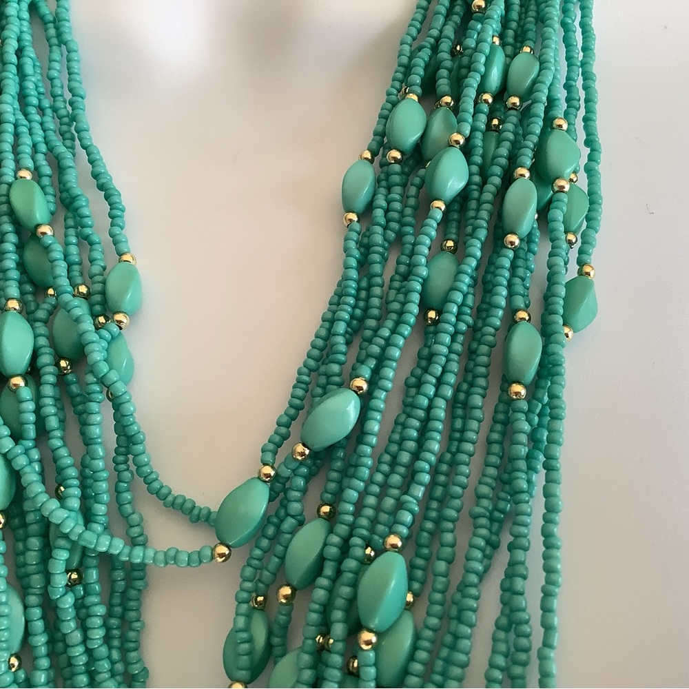 Turquoise colored beads, and gold , multi layered necklace